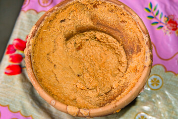 still picture of sweet curd desert kept in a clay pot