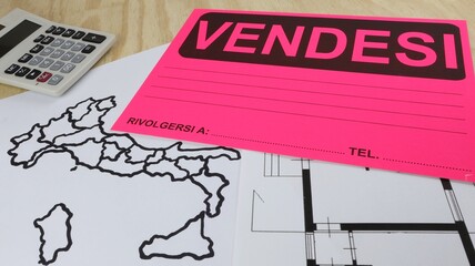 Printed sign represents real estate for sale with map of Italy