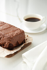 Fresh homemade chocolate sponge cake on wooden board