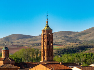 Mudejar tower of the church of the Assumption of Our Lady of Baguena from the 17th century. Teruel, Aragon, Spain.