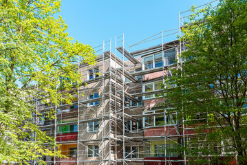 Modern residential apartment building under construction. Reconstruction of a building. Summer day.