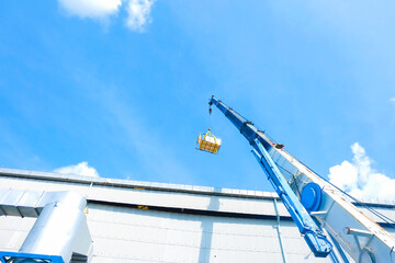 A crane is moving things up high.