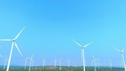 A panoramic drone view reveals a symphony of towering wind turbines, their sleek blades slicing...