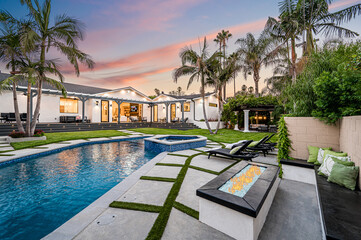 Spacious backyard pool with palm trees in a modern new construction home in Los Angeles