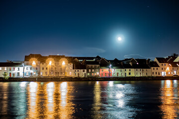 Captivating long exposure shot of Galway's iconic Long Walk under the enchanting glow of a full moon