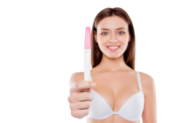 Motherhood parent mum parenthood concept. Close up photo of glad woman wearing white bra holding focused pink and white test isolated on blurred white background with copy-space