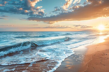 Golden sunlight reflecting on gentle ocean waves and sandy beach