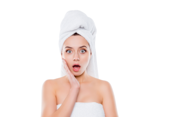 Portrait of frustrated worry woman after shower with towel on head holding hand palm on cheek with wide open mouth and eyes isolated on white background