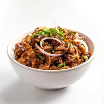 A white bowl containing a generous portion of Mexican-style Machaca, showcasing a savory combination of meat and onions