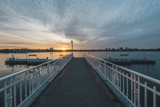 Germany, Hamburg, Empty jetty on Alster lake tat sunset
