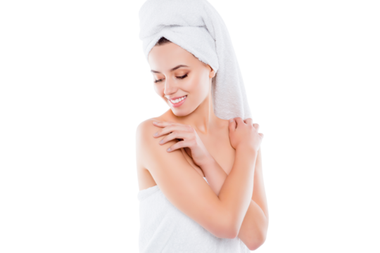 Portrait of tender sensual girl after shower with turban on head touching enjoying perfect smooth skin with looking at body sisolated on white background