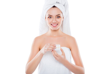 Portrait of pretty sexy woman in towel and turban on head holding presenting cream for problem...