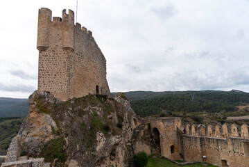 Panoramic view of the ruined tower of the medieval castle in the tourist town of Frías in the province of Burgos on a cloudy day.
