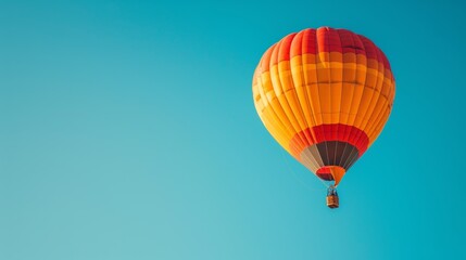 Naklejka premium A clear blue sky with a single hot air balloon floating peacefully.