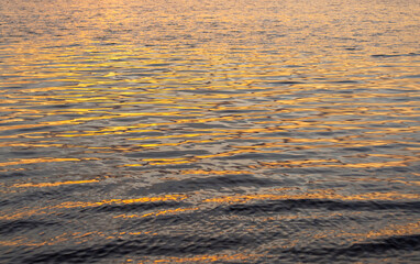 beautiful sky and reflection of the sun and sky in the lake water