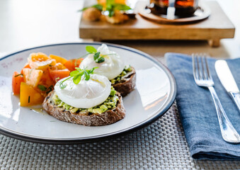 sandwich with avocado and poached eggs