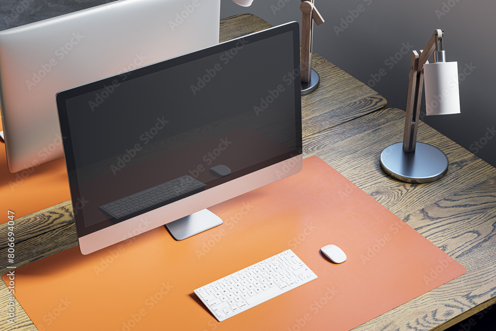 Poster Close up and above view of designer office desktop with mock up computer display on wooden desk, rug, lamp and other items. Mock up, 3D Rendering.