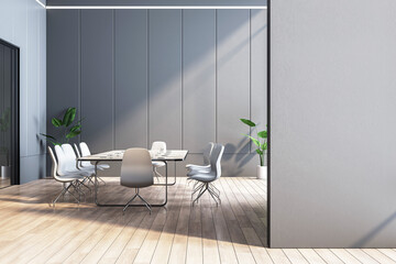Modern meeting room with table, chairs, and plants on a wooden floor and gray background, concept of business workplace. 3D Rendering