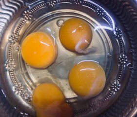 Group of raw yolks on a plate