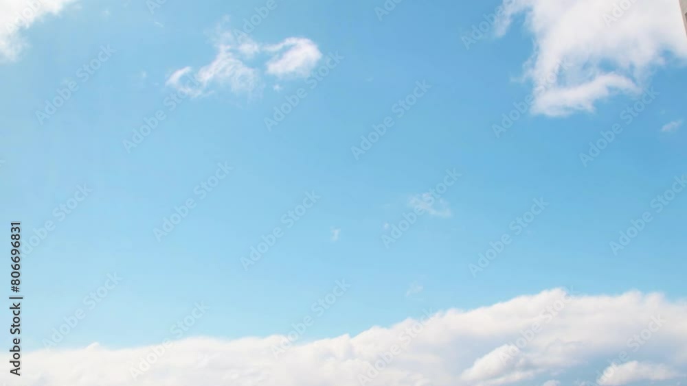 Wall mural summer sky with white, cumulus clouds. background with empty space for titles. clouds frame copy spa