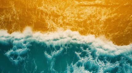 Aerial view of serene coastal waves with a golden hue, creating an abstract texture