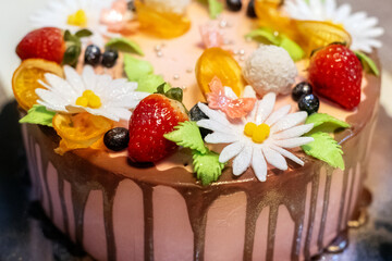 Festive cake with strawberry and flowers
