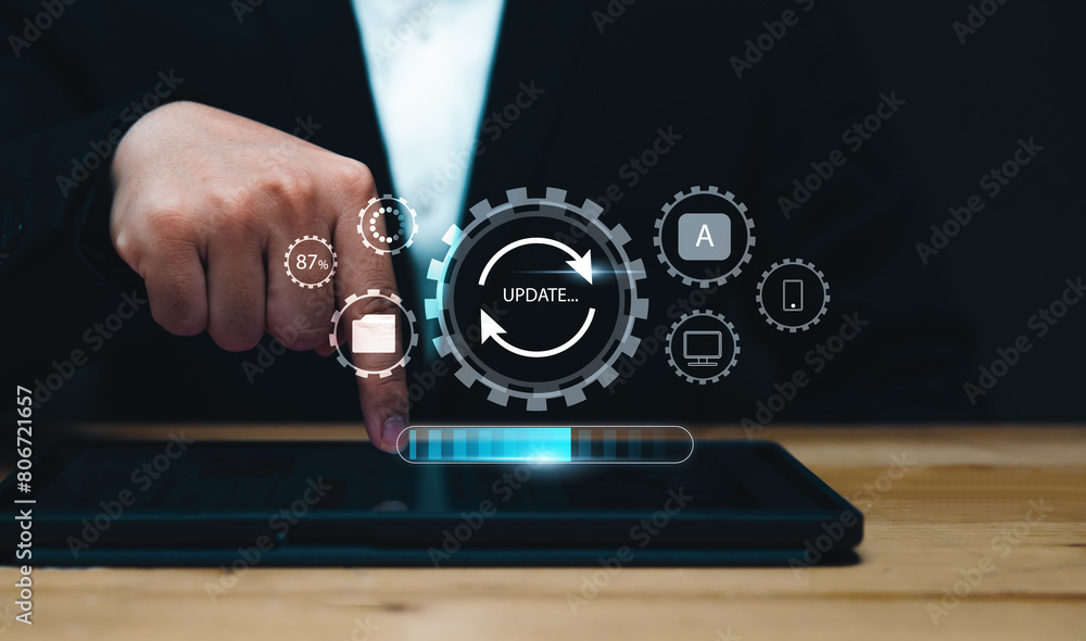 Fototapete Installing update system software for device operating systems to be up to date with the new version. Graphics icon showing updating function screen loading on computer tablet.