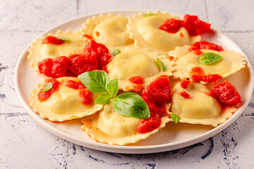 Ravioli with tomato sauce and basil