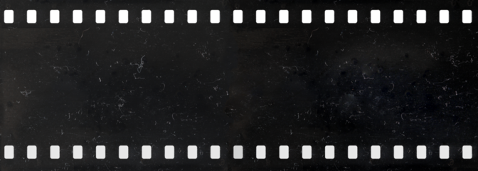 Long strip of old celluloid film with dust and scratches