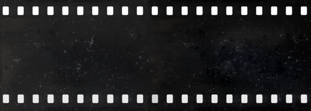 Long strip of old celluloid film with dust and scratches