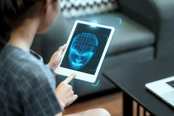 Asian businesswoman usingcomputer tablet scanning  face ID to unlock device security with facial recognition technology for identification, with graphical technology illustration.