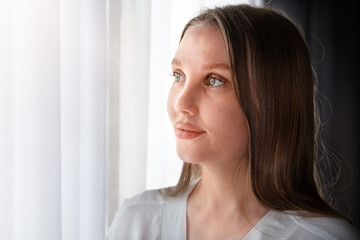 Portrait of a woman near the window