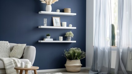 Navy blue accent wall with cream floating shelves displaying cream decor pieces.