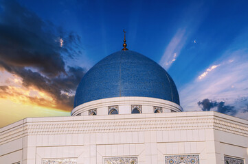 blue dome of modern white Islamic Masjid Minor Mosque in Tashkent in Uzbekistan on background of...