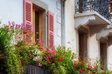 Multicolored window flowers decorations, France