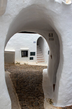 Binibeca Vell, picturesque and charming town in Menorca. Cobblestone streets, all whitewashed houses, low-rise wooden balconies. A jewel bathed by the crystal clear waters of the island, Spain
