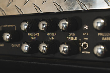 guitar amp knobs from a near view, sound control, musical concept. High quality photo