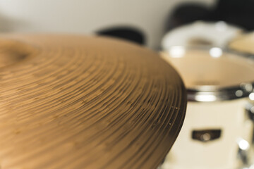 Close up of golden bronze cymbal plate part of drum. High quality photo