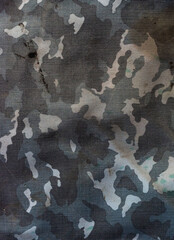Camouflage fabric covered with dirt, stains, dust