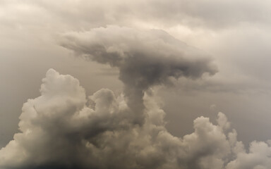 Bizarre sky sights, ominous cloud like mushroom in dark sky