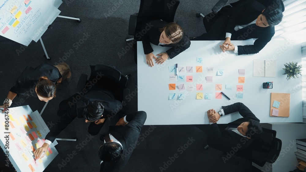 Aufkleber top down aerial view of business group sharing and brainstorming idea by using sticky notes at meeti