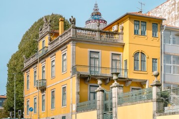 side view of a traditional yellow house in the center of town. Porto, Portugal