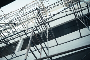 Construction building site with framework railing guard walkway on the building for workers to...