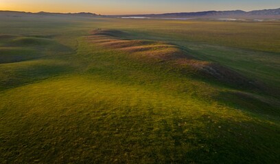 Grass covered rolling hills st sunset. Carrizo National Monument, Santa Margarita, California, United States of America.