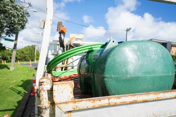 Pump and pipes on a truck on the roadside. Auckland.