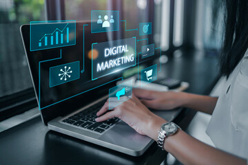 Digital marketing strategy concepts, using a laptop creating  online advertisements on social media and websites for traffic and awareness through video contents. Working in an office.