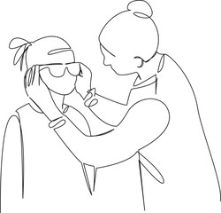 Mom puts glasses on her daughter