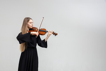Woman professional violist playing musical instrument