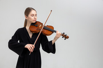 Woman musical artist playing violin
