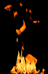 fire on a black background, burning and hot flames, close view